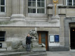 Kara with a lion sculpture outside the museum